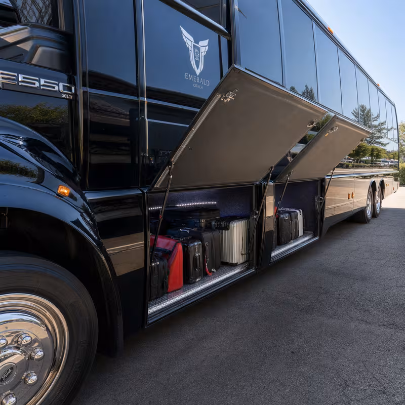 Party bus interior with wraparound leather seating and LED lighting in Irving