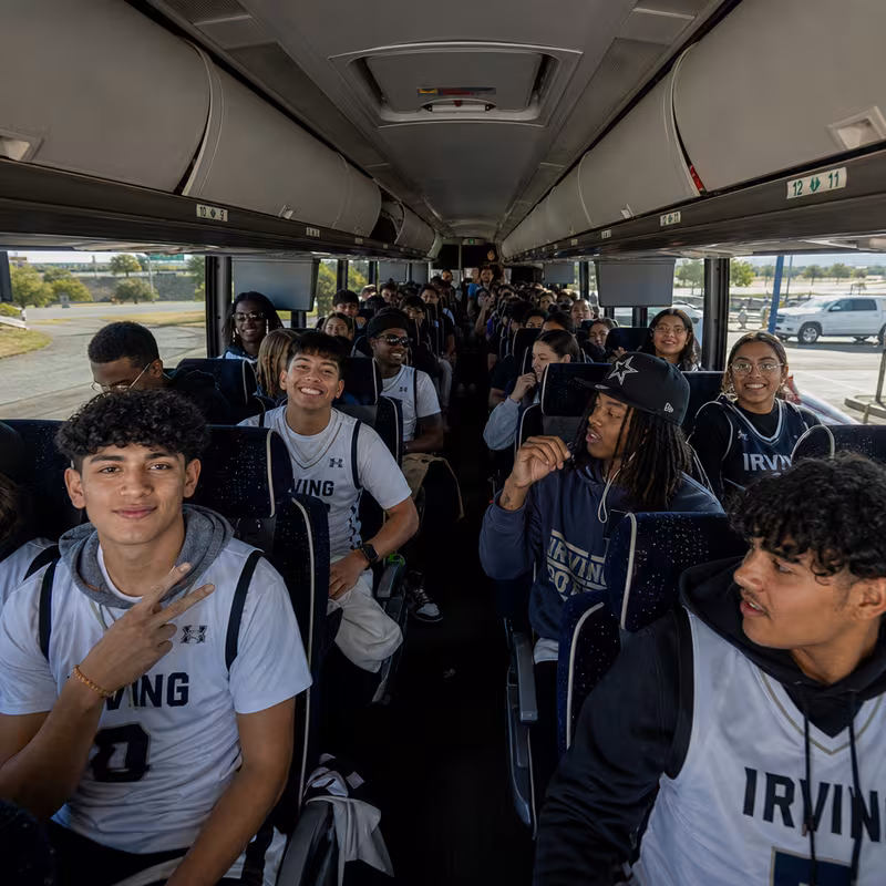 Black Mercedes Sprinter van staged for an Irving Sporting Event Transportation group