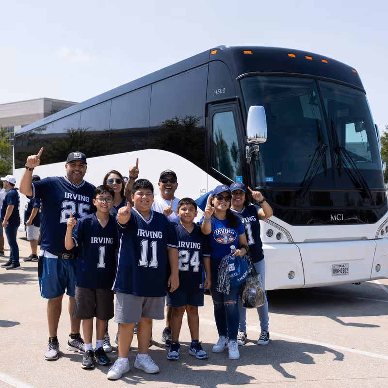 Passengers loading luggage while boarding an Irving group shuttle