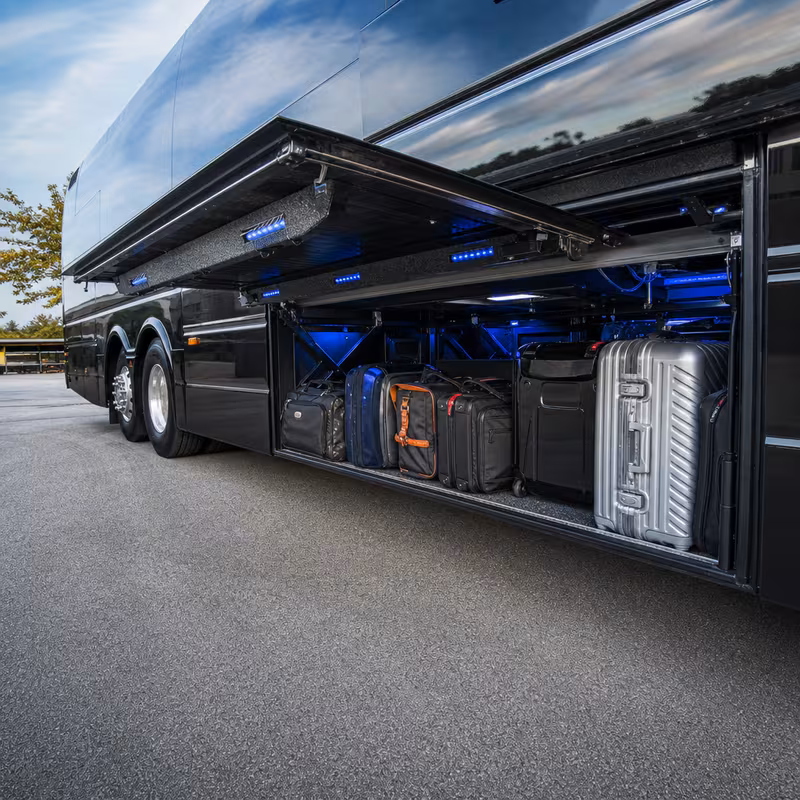 Party bus interior with wraparound leather seating and LED lighting in Irving