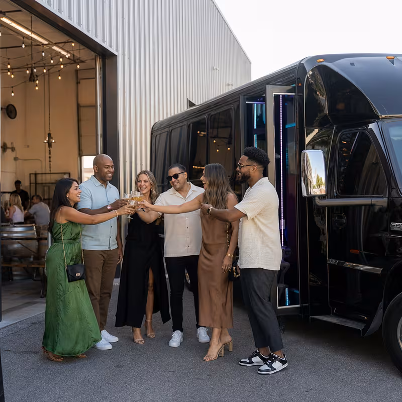 Passengers loading luggage while boarding an Irving group shuttle